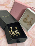 TUVELLE gold-tone open teardrop earrings with sparkling clear stone detailing
