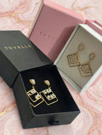 TUVELLE gold-tone open teardrop earrings with sparkling clear stone detailing