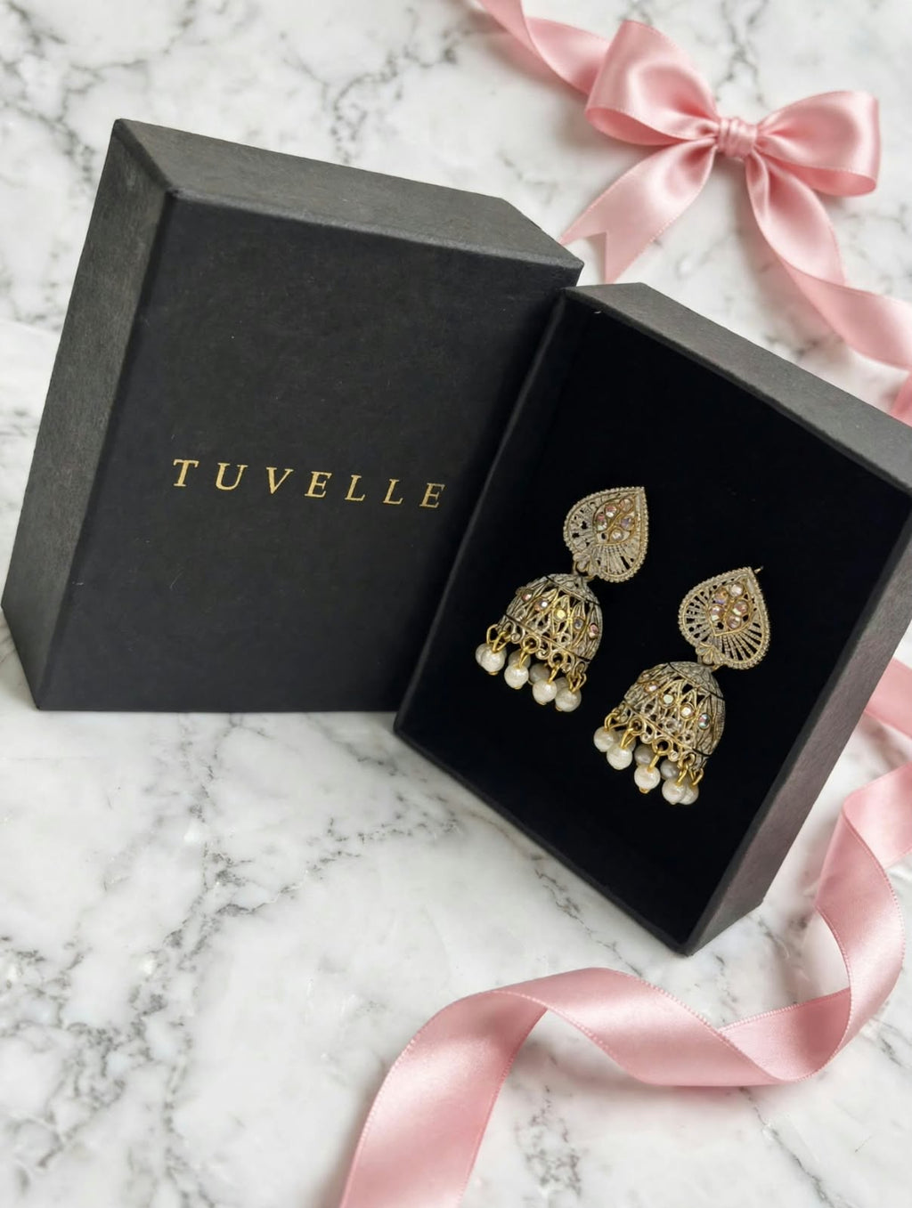 Mehr filigree jhumka earrings beside an open TUVELLE box